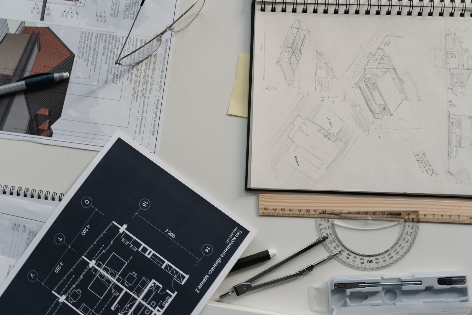 Architectural blueprints and plans on a desk